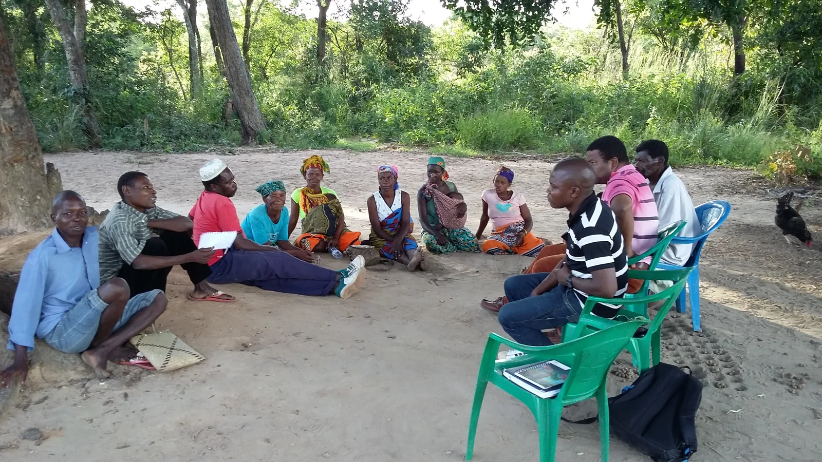 Community members meeting in a circle to plan a local initiative